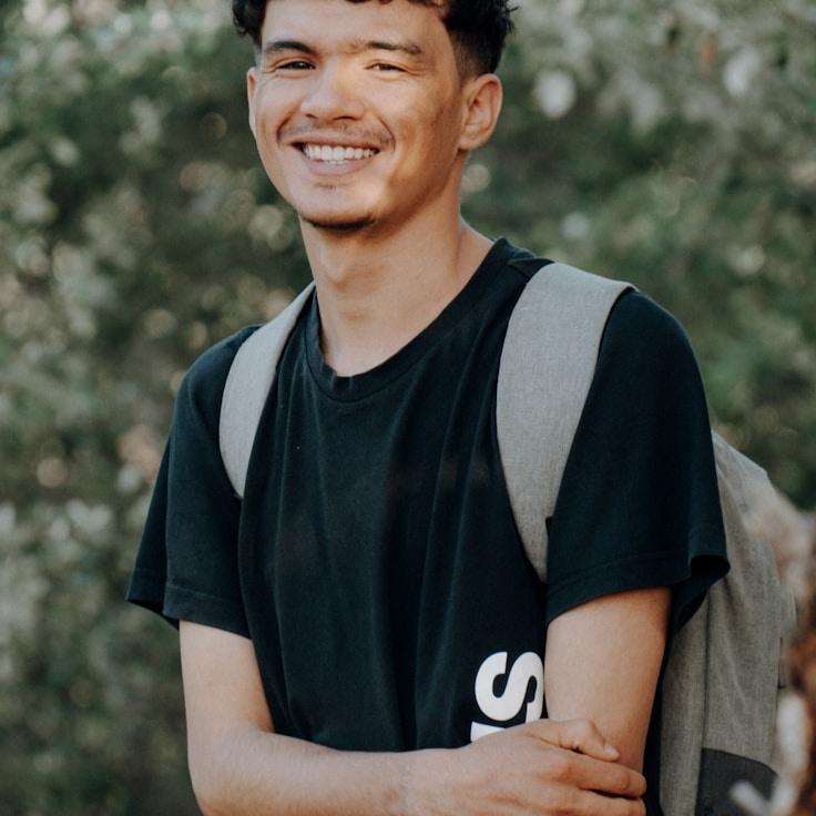 Ava Mehta, Lead Design Curator at LumiVecturania, reviewing corporate floral arrangements